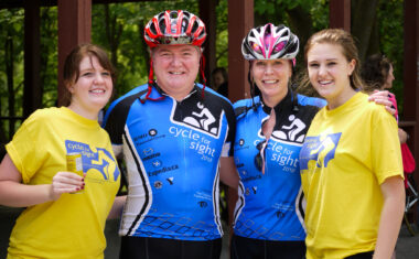 Dave poses with his wife Donna and their two children Michelle and Christine