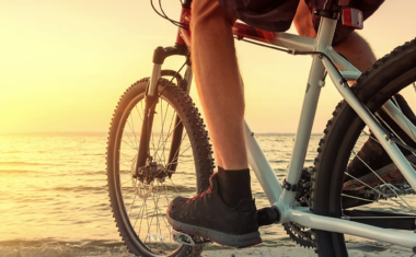 photo of a bike facing the sunset