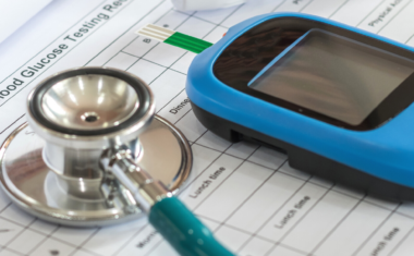 diabetes monitor resting on piece of paper