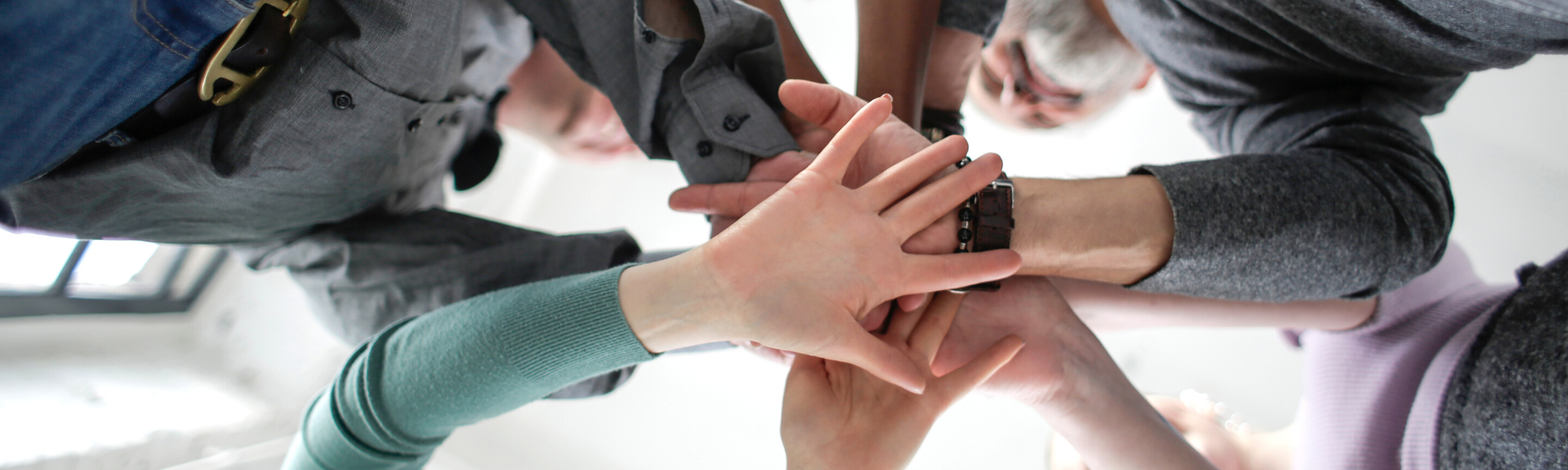Image is of hands joined together in 