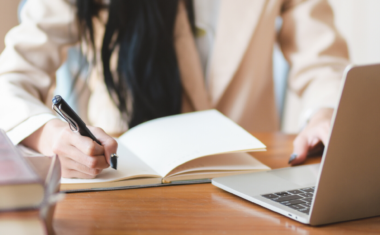 image is of a woman using her laptop