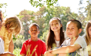 Image is of children outdoors laughing