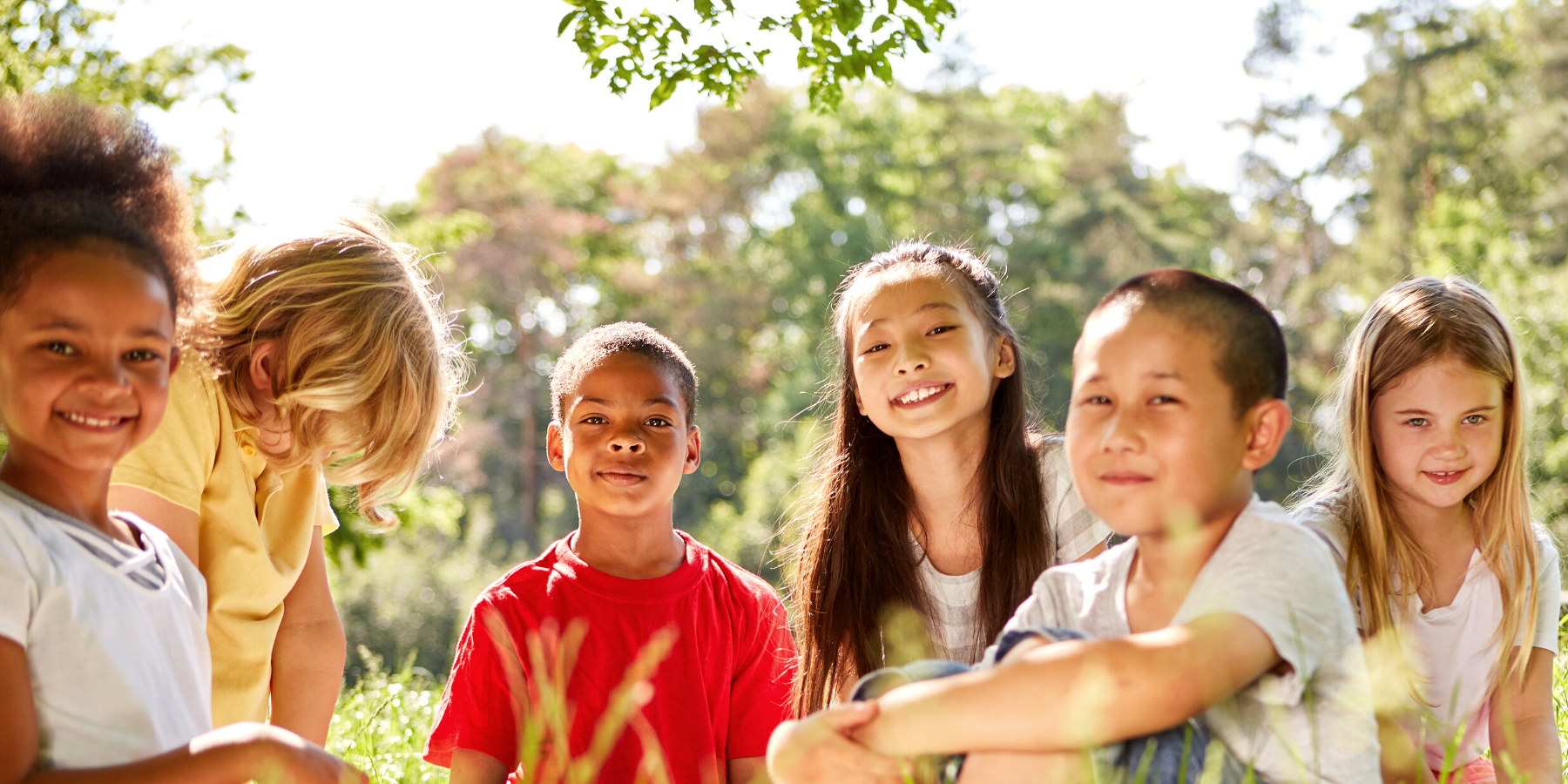 Image is of children outdoors laughing