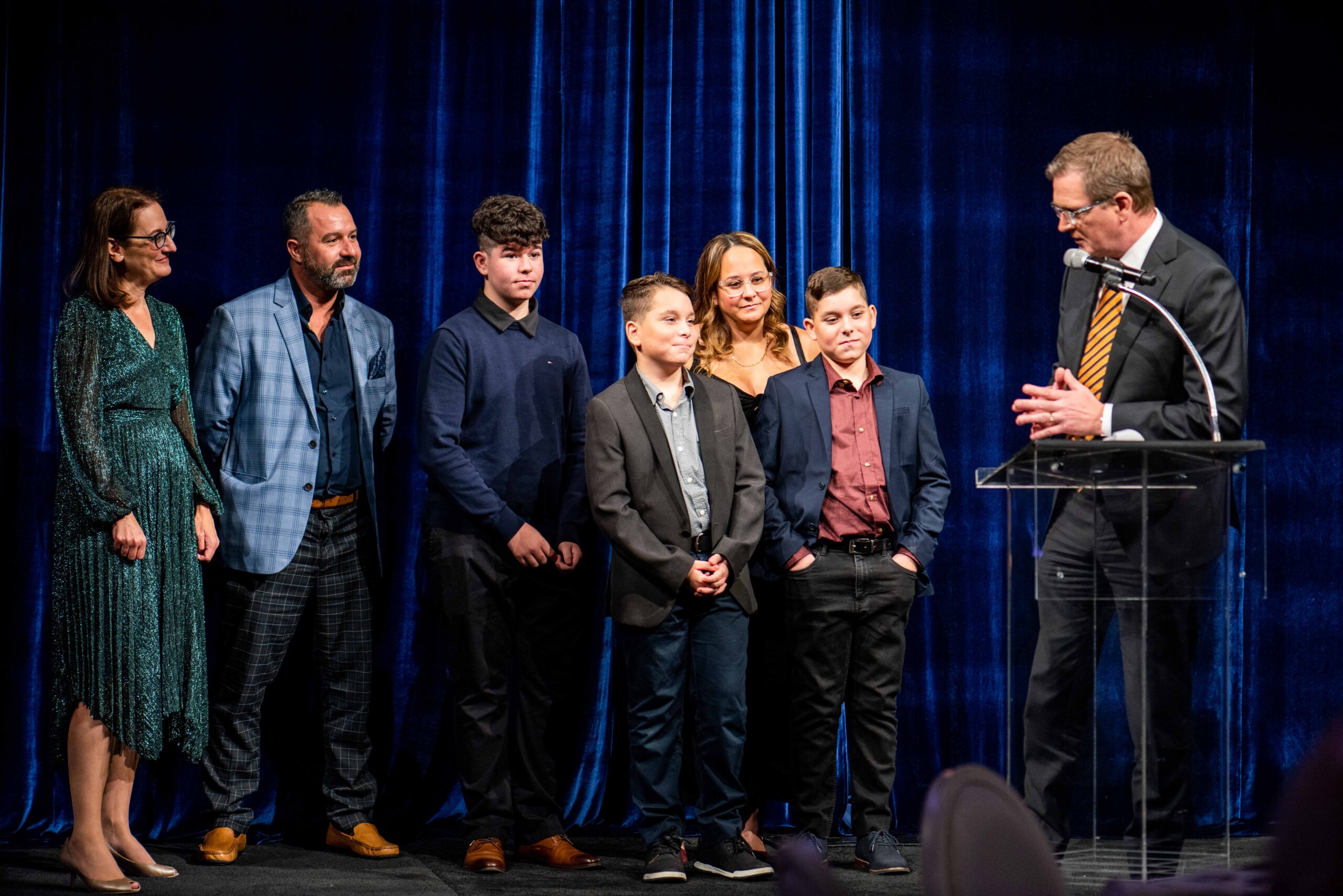 Image is of Comic Vision event host with Andre and Nathan and family.