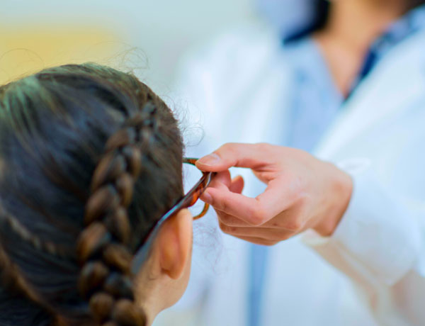 Girl being fitted for glasses