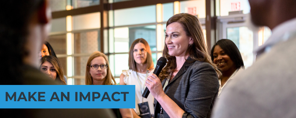 Image of female speaker holding a microphone with text that reads, 'make an impact.'