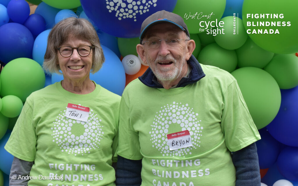 Image is of two volunteers smiling during Cycle for Sight Events.