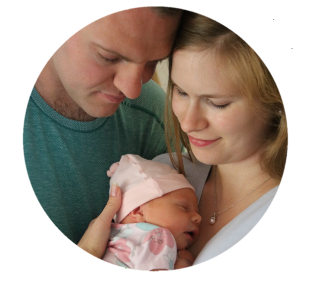 Image is of Matthew and Stephanie Jones holding their newborn child.