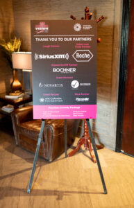 Image is of the sponsor sight indicating, sirius XM, Roche, Bochner Eye Institute, Novartis, Heathbridge Capital Management LTD.,