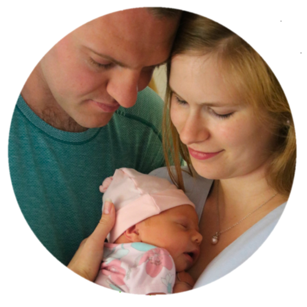 Image is of Matthew and Stefanie with their newborn child.