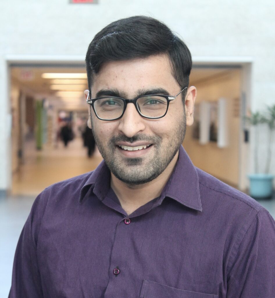 Image is of Ali Usman smiling.