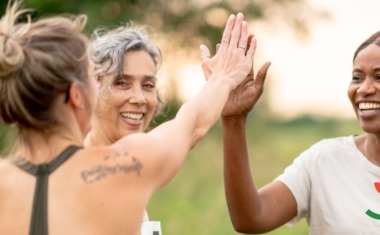 Women high fiving each other