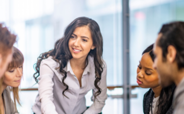 Image of people at a meeting.