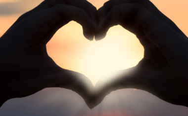 two hands together in the shape of a heart