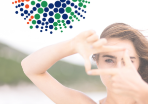 woman with hands framing her eye