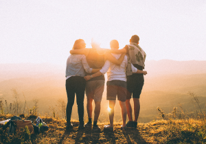 People at the top of a hill with a view