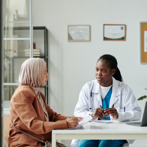 female doctor speaking to female patient