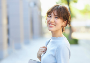 A young woman smiling