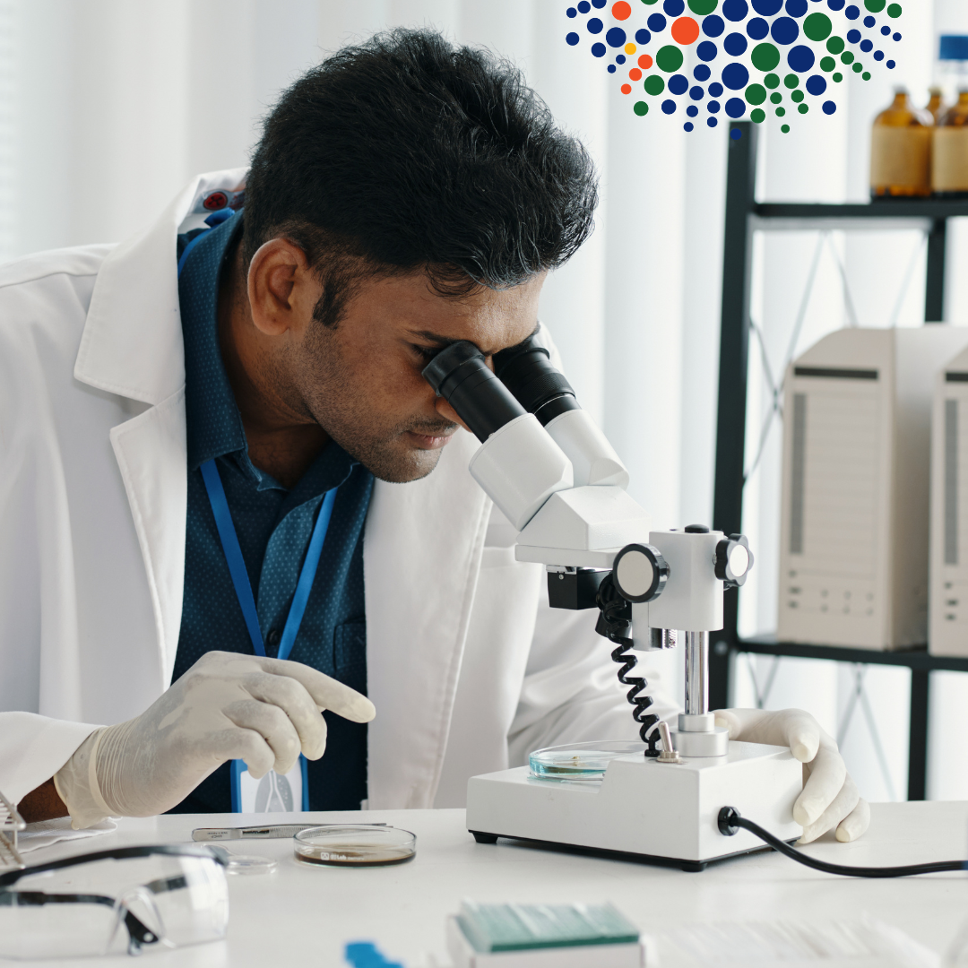 Scientist looking at a microphone