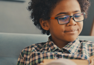 young boy reading