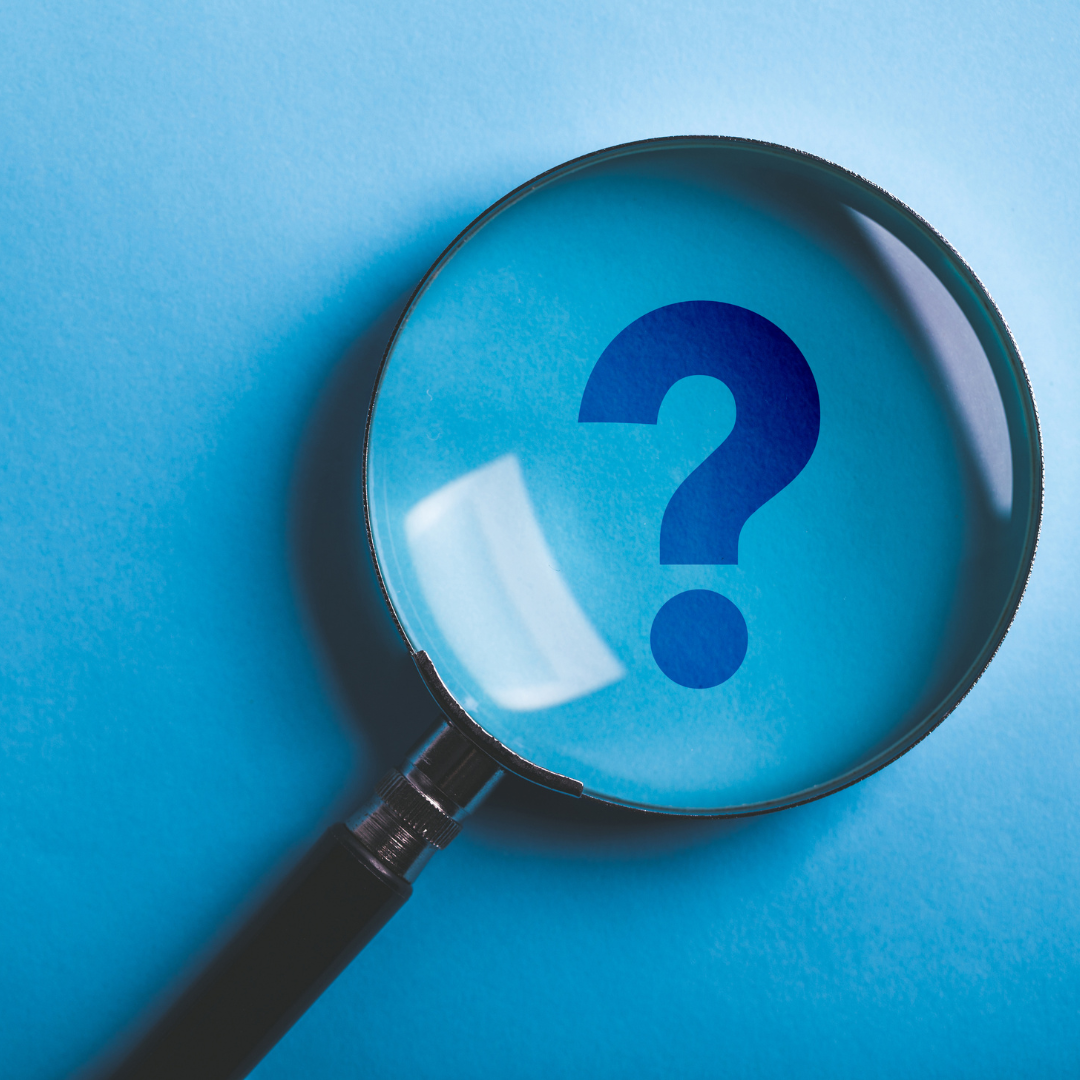 question mark in magnifying glass