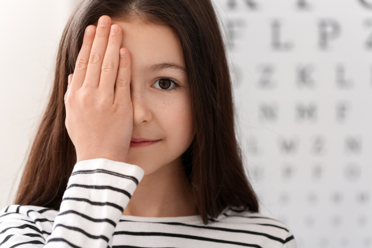 young girl having eye exam